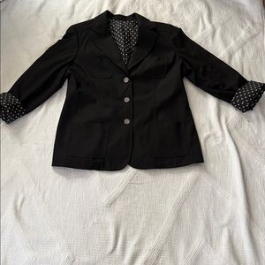 Black jacket size L. Measurements are available, but there are no tags.